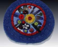 A blue boho-style pin