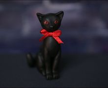A toy black cat