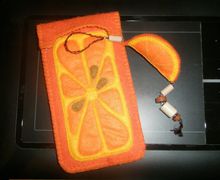 A phone case with a charm