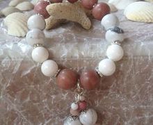 A wristlet with natural stones on an elastic lace