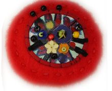 A red Boho-style pin