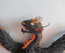 Quetzalcoatl a necklace and a magnet on the refrigerator two in one