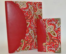 A passport cover and a notepad