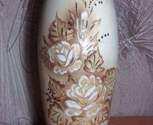 A big floor standing vase with roses