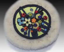 A white boho-style pin