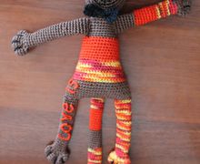 Enamoured cat knitted toy