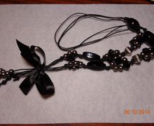 A jewel of beads and cord