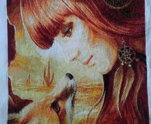 Completed girl and fox cross-stitch embroidery