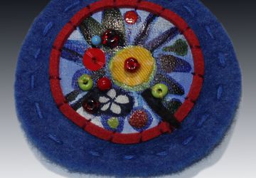 A blue boho-style pin