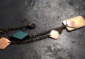 Necklace with brass and copper rectangular pieces with turquise