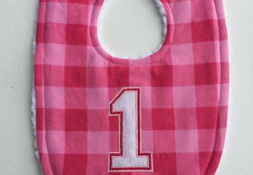 Pink buffalo plaid birthday bib for girls