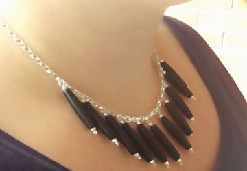 Edgy sterling silver bib necklace with black bone beads