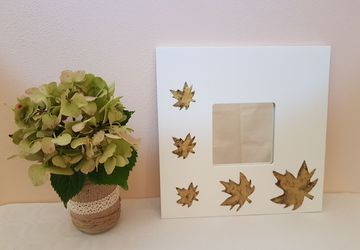 Personalized mirror with antique gold colored leaves and transparent resin