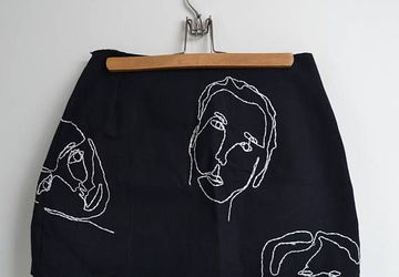 Embroidered oneline face skirt