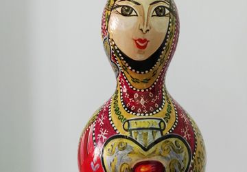 Woman Drawing on Dried Pumpkin