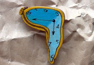 "Soft clocks" brooch