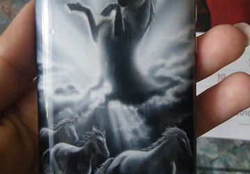 A phone case painted in aerographics