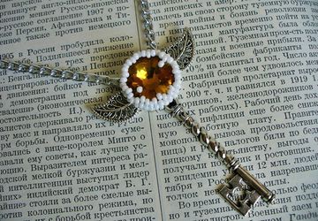 A pendant "A winged key"