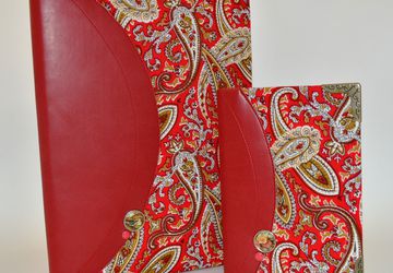 A passport cover and a notepad