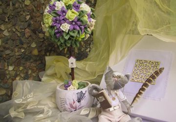 A composition with cat Tilda and topiary