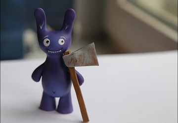 A ceramic bunny with an axe