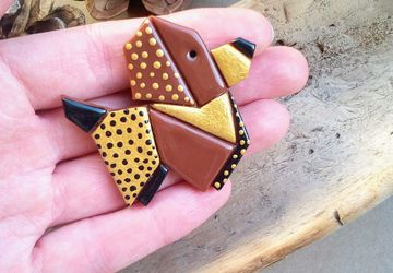 Origami style dog brooch made from polymer clay