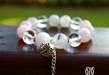 A wristlet with natural quartz on an elastic lace