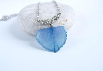 A pendant made of blue hydrangea petal