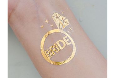 Shimmering Gold Bride With Diamond Ring Tattoo For An Unforgettable Hens Night