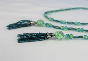 Green open-ended necklace, beaded with tassels, boho, trendy, glass beads, long