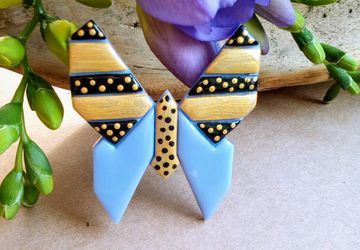 Minimalist graphic origami style butterfly brooches made of polymer clay