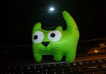 A green toy cat