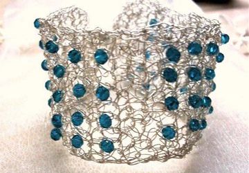 Silver wire crochet bracelet with blue beads