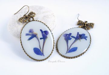 Big earrings with larkspur blossom clusters