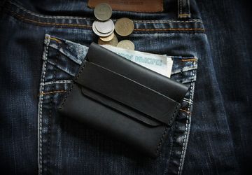 A compact cardholder (wallet)